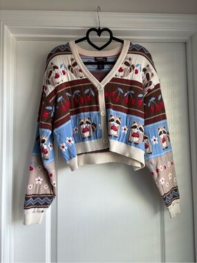 Hot Topic Cropped Raccoon Jacquard Cardigan in Cream, Brown, Light Blue, Red